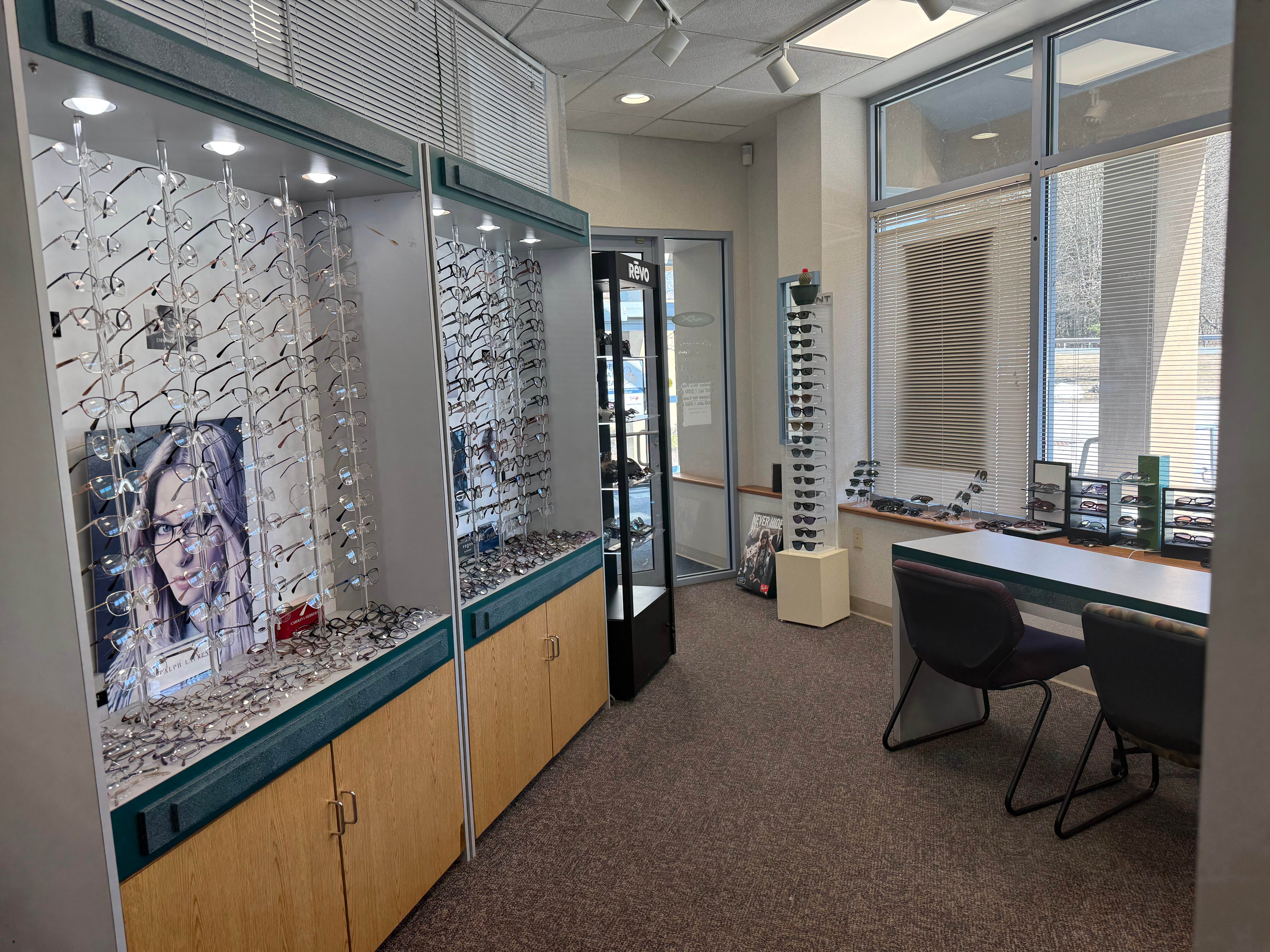 Central Mass Eyewear showroom with extensive frame displays and consultation area